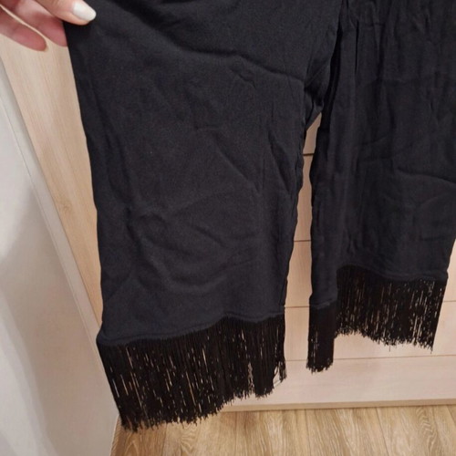 Zara jumpsuit like new, black with fringes at hem