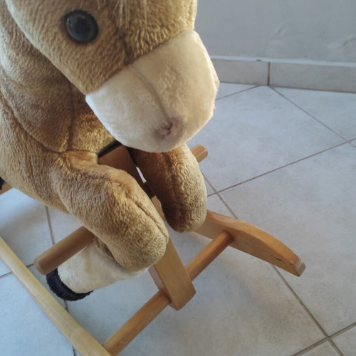 Wooden rocking horse like new with plush carriage