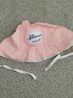 Baby hat like new pink with tie cord