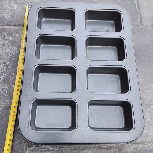 Nonstick baking pan with 8 rectangular molds for mini cakes and buns
