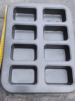 Nonstick baking pan with 8 rectangular molds for mini cakes and buns