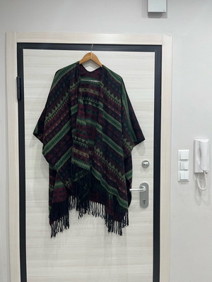 Women's wool cape used with multicolor pattern