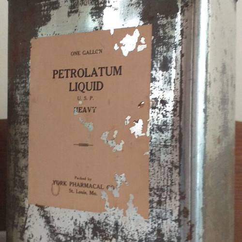 Old metal containers set with Mobil, ZAAE and Petrolatum Liquid