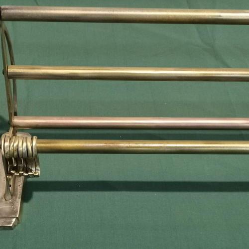 Brass wall-mounted hanger used