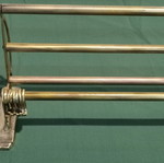 Brass wall-mounted hanger used