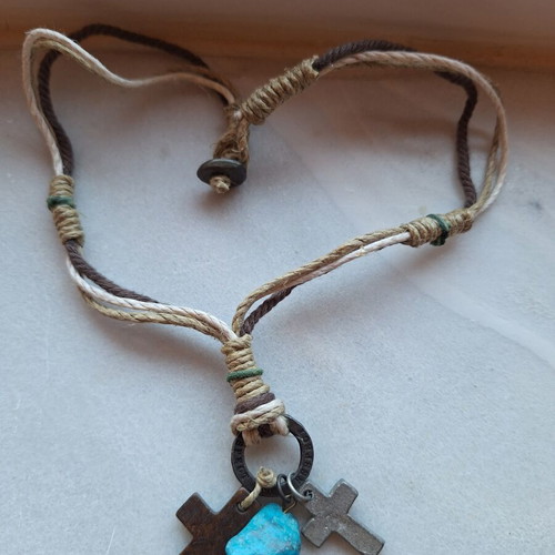 Necklace like new with woven cords, wooden cross, metal cross, and turquoise stone