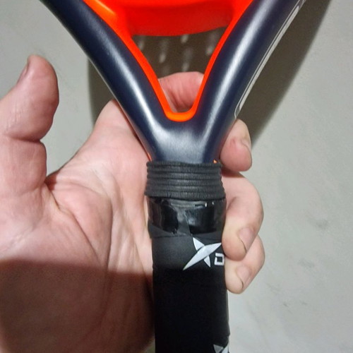 Padel racket used, moderate condition with small cracks