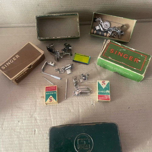 Sewing machine parts used, all together with boxes