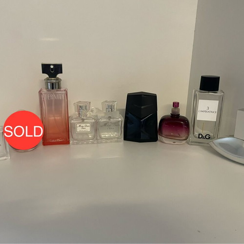 Collection of 44 empty genuine perfume bottles, various brands