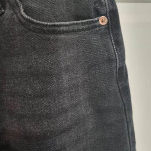 Jean with crooked button fastening black size small, new with tags