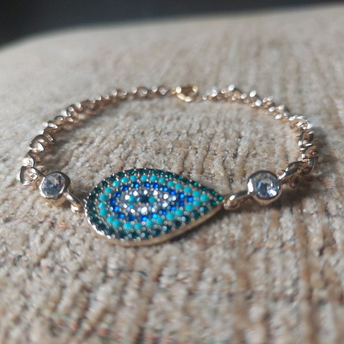 Gold bracelet new with eye and blue, turquoise, white stones
