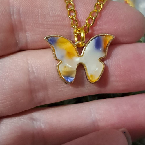 Jewelry set with colorful butterfly and gold metal elements