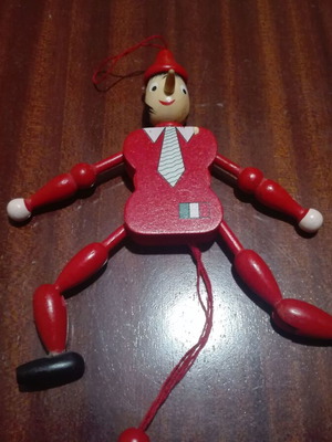 Wooden Pinocchio marionette used with movable joints