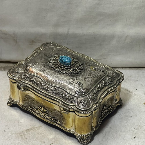 Vintage metal jewelry box with blue scarab, used