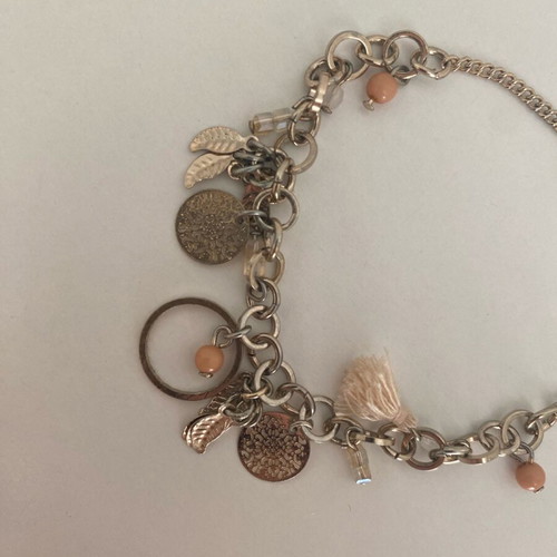 Accessorize bracelet with charms in pink and gold, like new