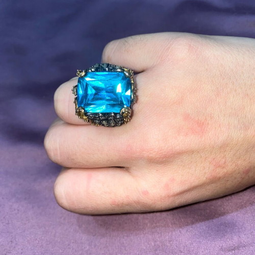 Silver ring plated with 9K gold, like new, blue topaz center