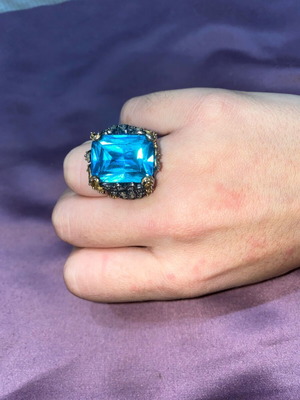 Silver ring plated with 9K gold, like new, blue topaz center