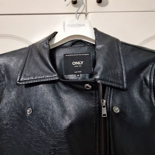 Only black biker jacket made of faux leather with silver details used