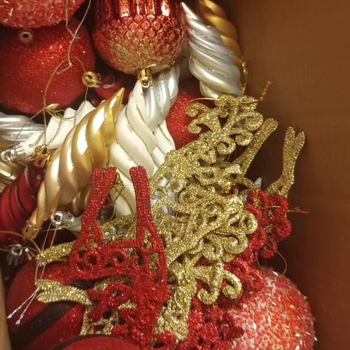 Christmas ornaments like new, box with balls and branches in gold red silver white tones