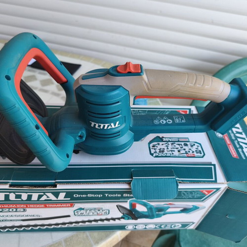 Total cordless hedge trimmer with battery and charger