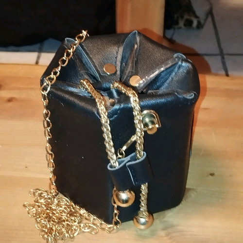 Modern pouch bag like new, black and gold