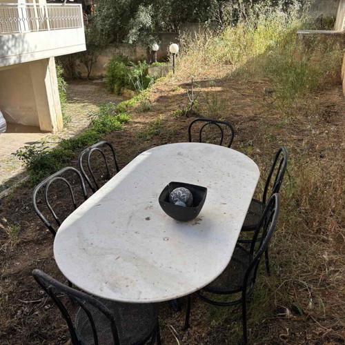 Garden table with marble and 6 metal chairs used