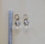 Earrings with transparent sphere used