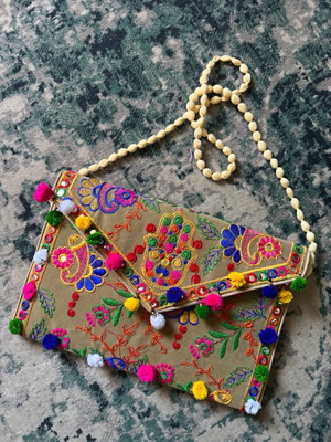 Boho clutch bag from Morocco like new with colorful embroidery and pom poms