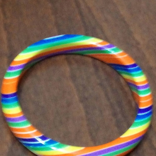 Set of 7 used neon rainbow resin bracelets 70s style