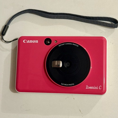Canon Zoemini C camera used, pink Polaroid-style with internal battery repair needed