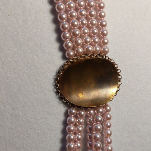 Handmade bracelet with bronze centerpiece and silver chain, new
