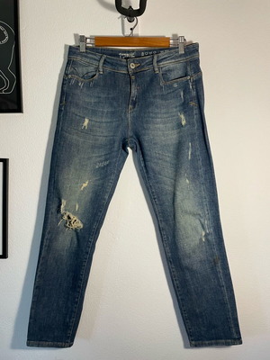 Blue Namaste jeans with rips like new, size W27