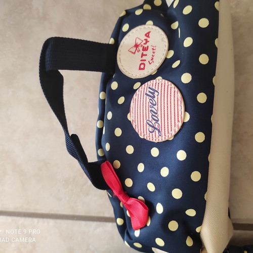 School backpack with pencil case used, polka dot design
