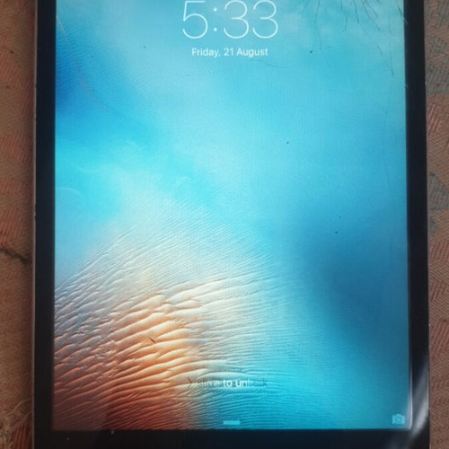 iPad Mini with SIM, cracked screen, partial touch functionality