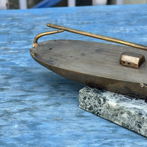 Vintage brass sailboat decoration on marble base, used