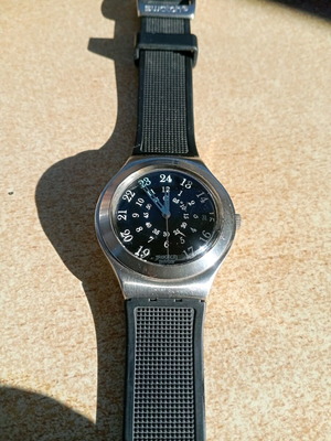 Swatch watch used, silver, works but does not change time