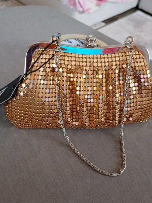 Evening hand bag new, metallic gold
