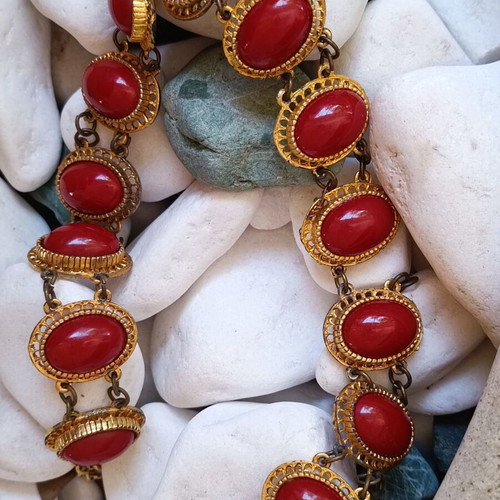 Vintage necklace used with red stones and brass metal