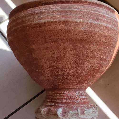 Clay flowerpot used with crack at base