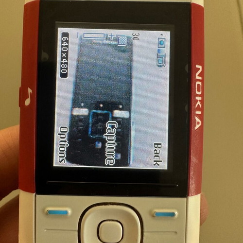 Nokia 5200 used, with new panel and battery for parts or restoration