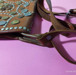 Collectible leather crossbody bag like new, brown with metal coins