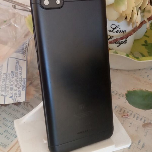 Redmi 6A black back cover with cracked camera lens