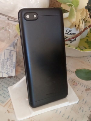 Redmi 6A black back cover with cracked camera lens