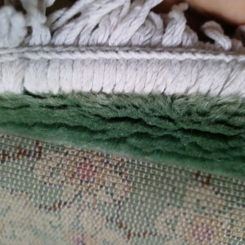 Rug 2.00x3.00 like new with mint-colored almond blossoms