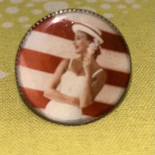 Ring used with printed woman in swimsuit design