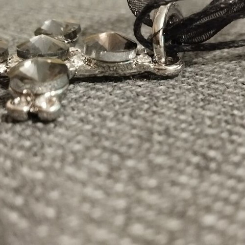 Women's necklace with large black stone cross and organza ribbon, like new