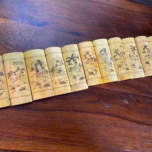 Vintage Asian folding bone carving with erotic scenes in natural ox bone
