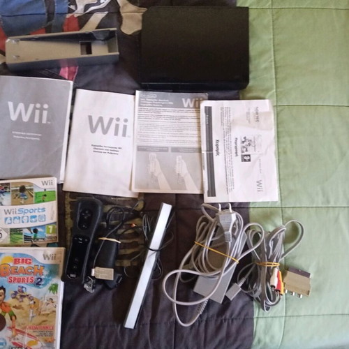 Nintendo Wii black used with Wii Motion Plus controller, nunchuk and 2 games