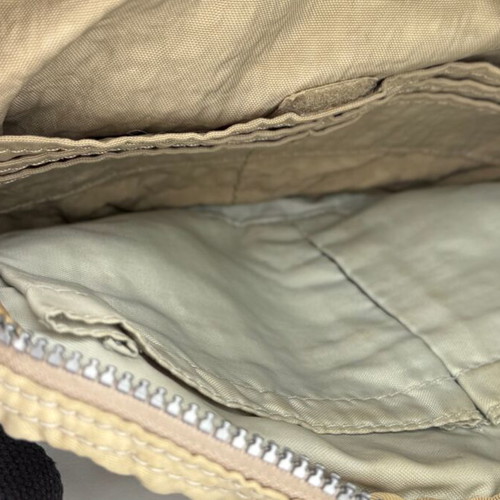 Kipling beige crossbody bag used with multiple compartments and strap