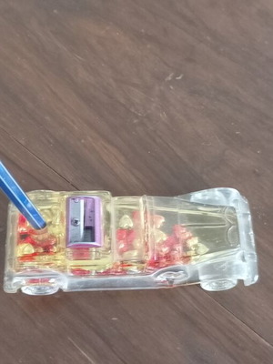 Vintage novelty pen holder used, car shaped with moving hearts